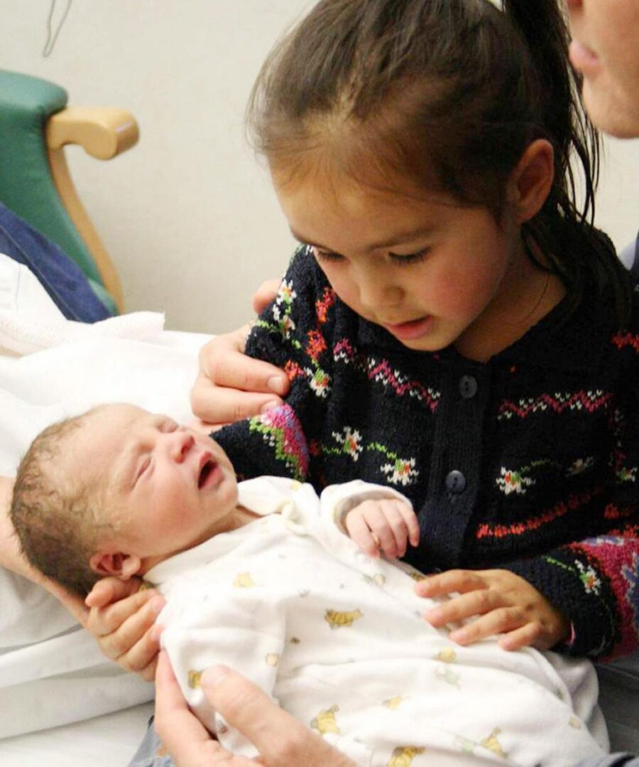 Joshua Titcombe with his big sister. died at 19 days old